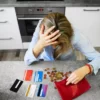 Money Worried Women with cards and empty wallet