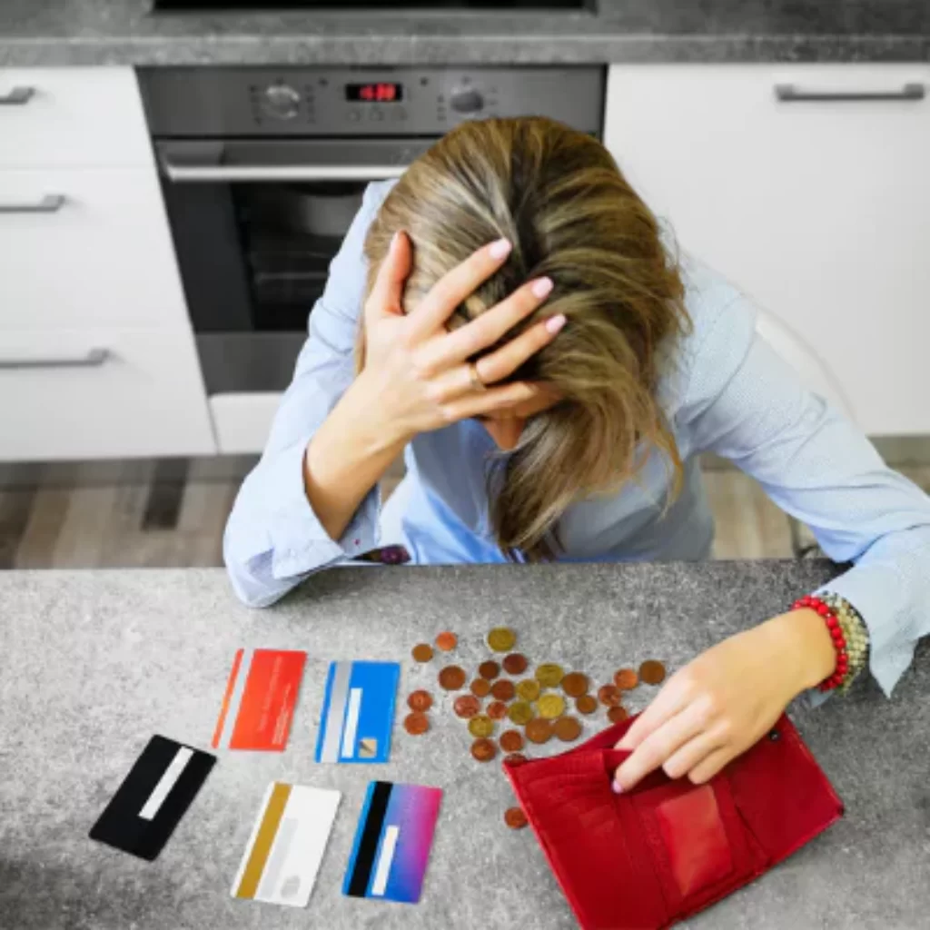 Money Worried Women with cards and empty wallet